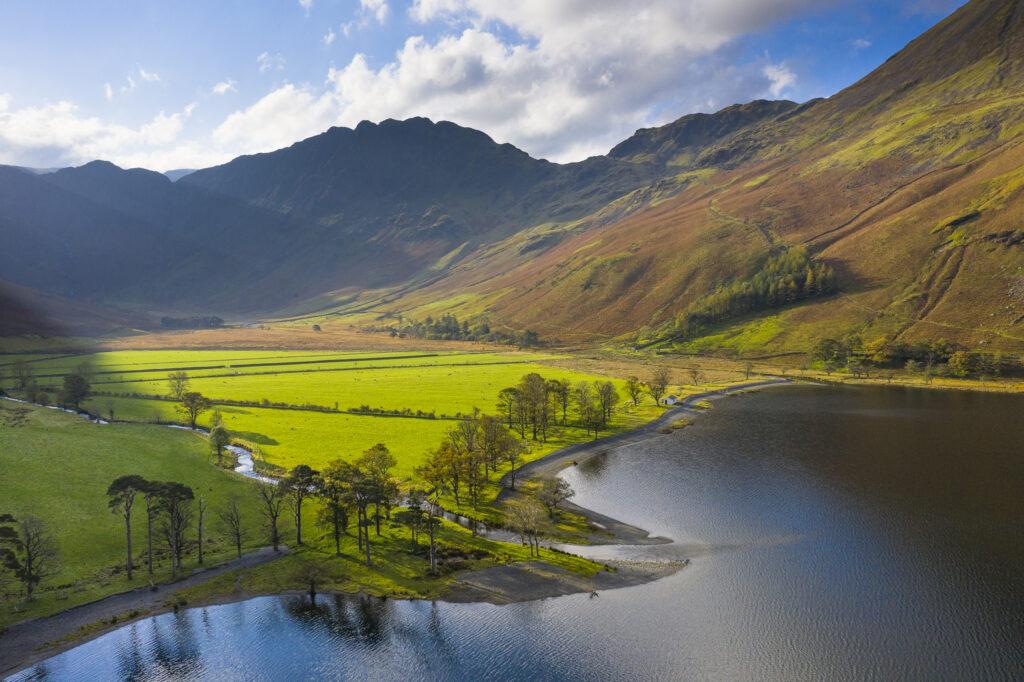 England, Cumbria, Lake District National Park. Aerial view of Buttermere lake shortly after sunrise on an autumn day.