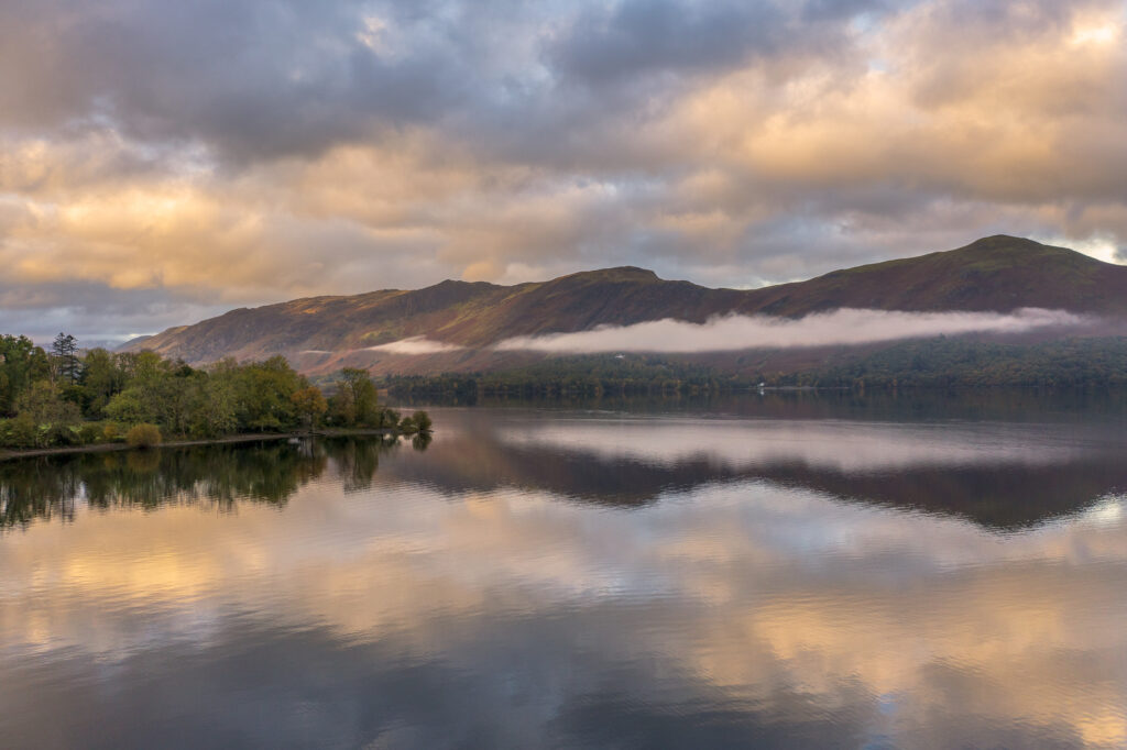 England, Cumbria, Lake District National Park. Aerial view of Derwentwater, a popular lake near Keswick, at dawn.