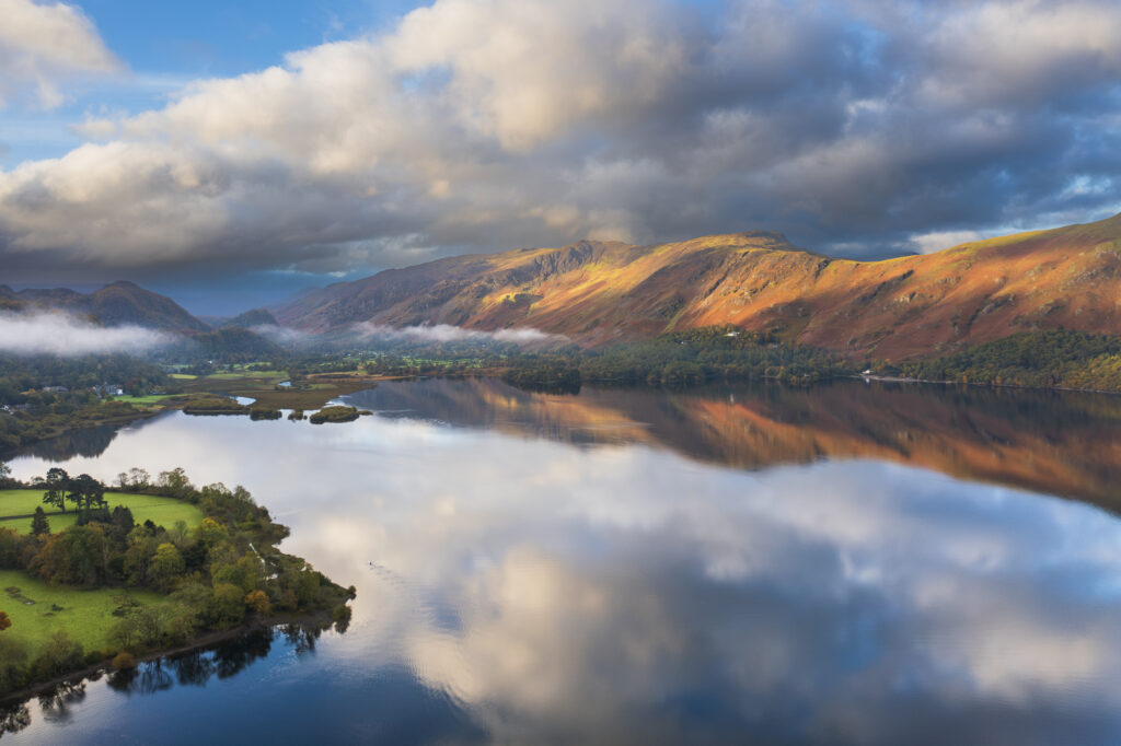 England, Cumbria, Lake District National Park. Aerial view of Derwentwater, a popular lake near Keswick, at dawn.