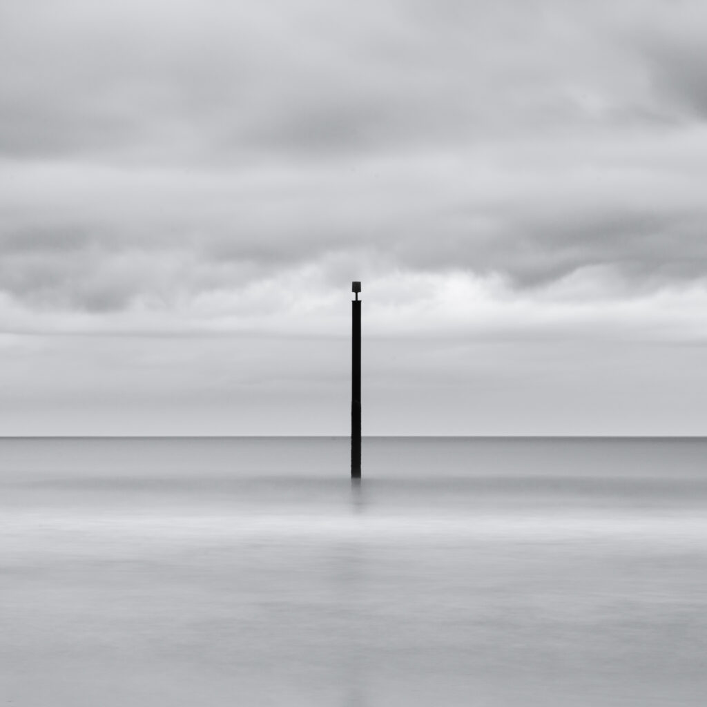England, Northumberland, Cambois. Marker posts in the north sea near Blyth.