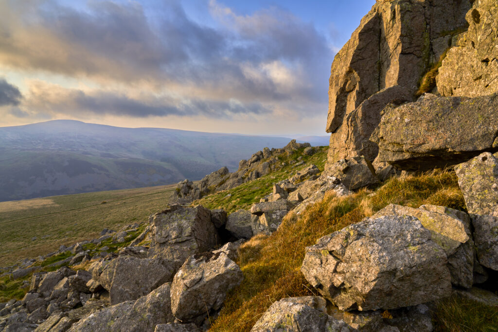 England, Northumberland National Park, Harthope Valley. Sunset at Langlee Crags located above the Harthope Valley.