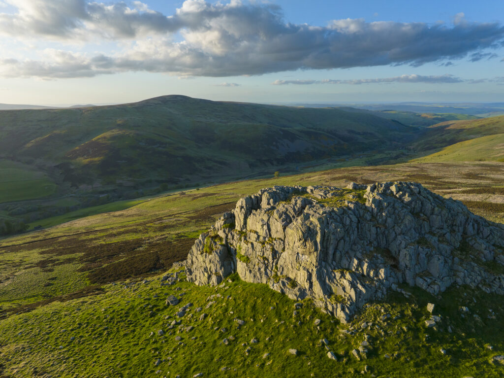 England, Northumberland National Park, Harthope Valley. Sunset at Housey Crags located above the Harthope Valley.