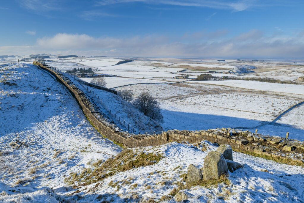 England, Northumberland, Northumberland National Park. A well preserved stretch of Hadrian's Wall passing along Caw Gap.