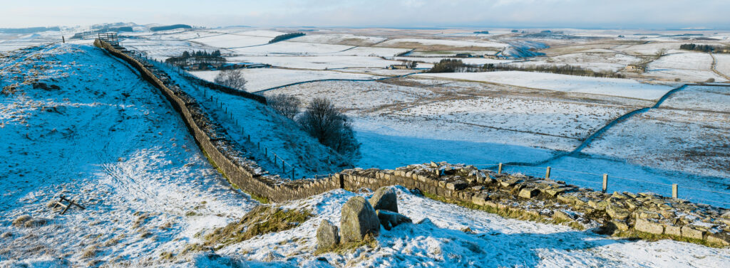 England, Northumberland, Northumberland National Park. A well preserved stretch of Hadrian's Wall passing along Caw Gap.