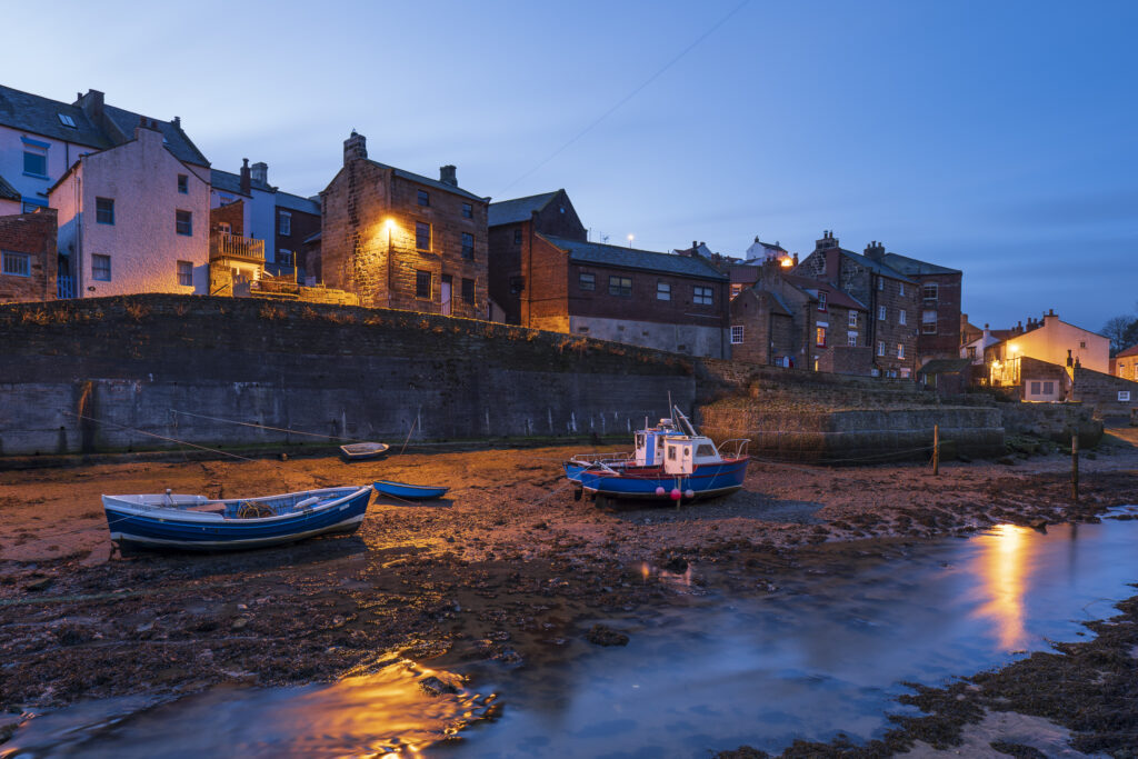 England, North Yorkshire, North York Moors National Park. Pre dawn light at Staithes, a coastal village in the North York Moors National Park.