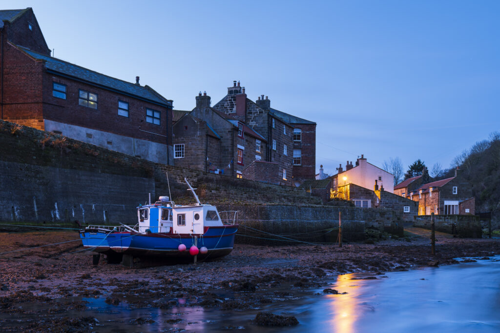England, North Yorkshire, North York Moors National Park. Pre dawn light at Staithes, a coastal village in the North York Moors National Park.