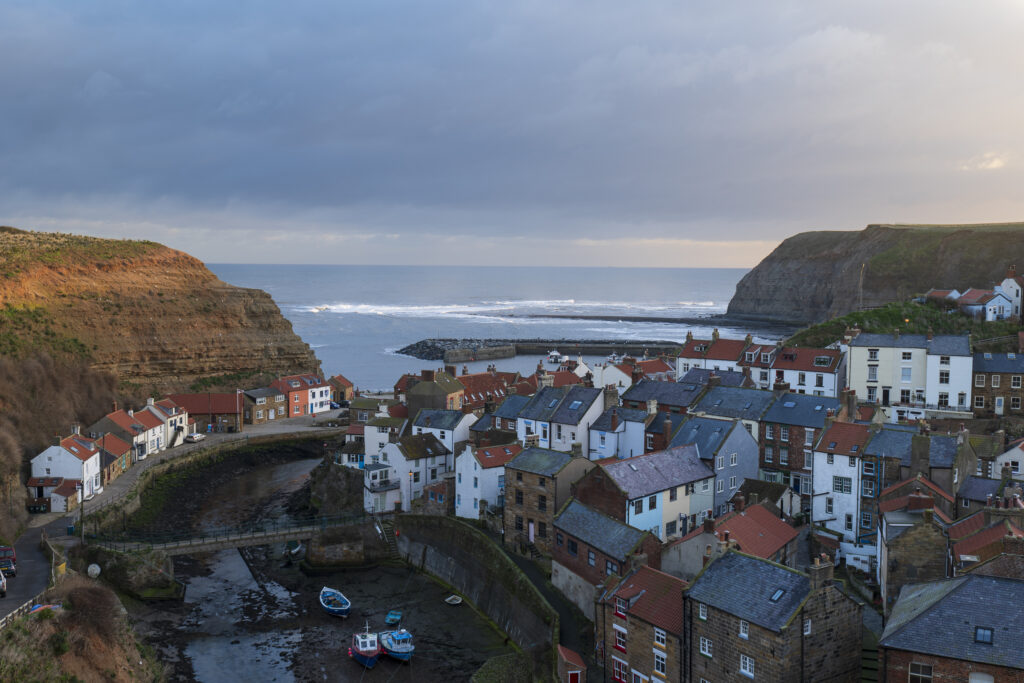 England, North Yorkshire, North York Moors National Park. Early morning light at Staithes, a coastal village in the North York Moors National Park.