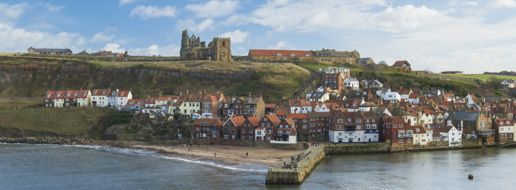 England, North Yorkshire, North York Moors National Park. Whitby Abbey located high above the popular seaside town of Whitby.