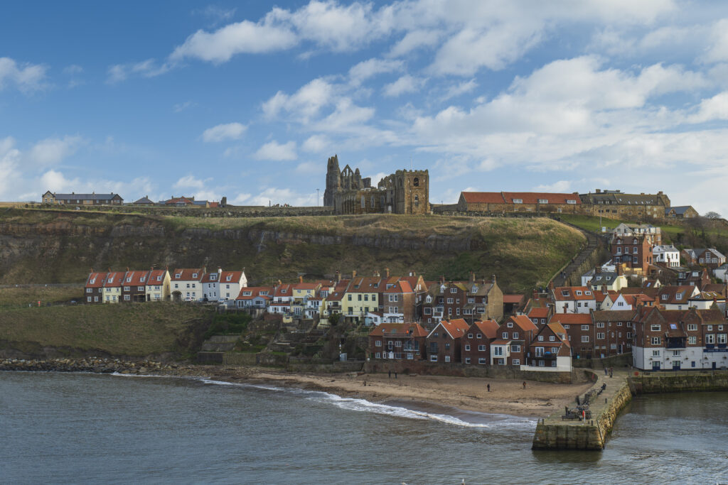 England, North Yorkshire, North York Moors National Park. Whitby Abbey located high above the popular seaside town of Whitby.