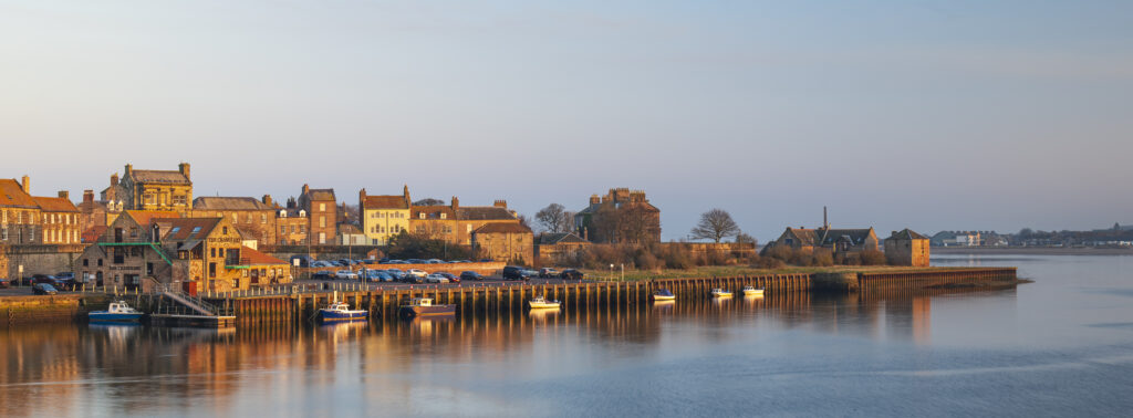 England, Northumberland, Berwick Upon Tweed. Panoramic view of the Quayside at Berwick Upon Tweed viewed at sunset.