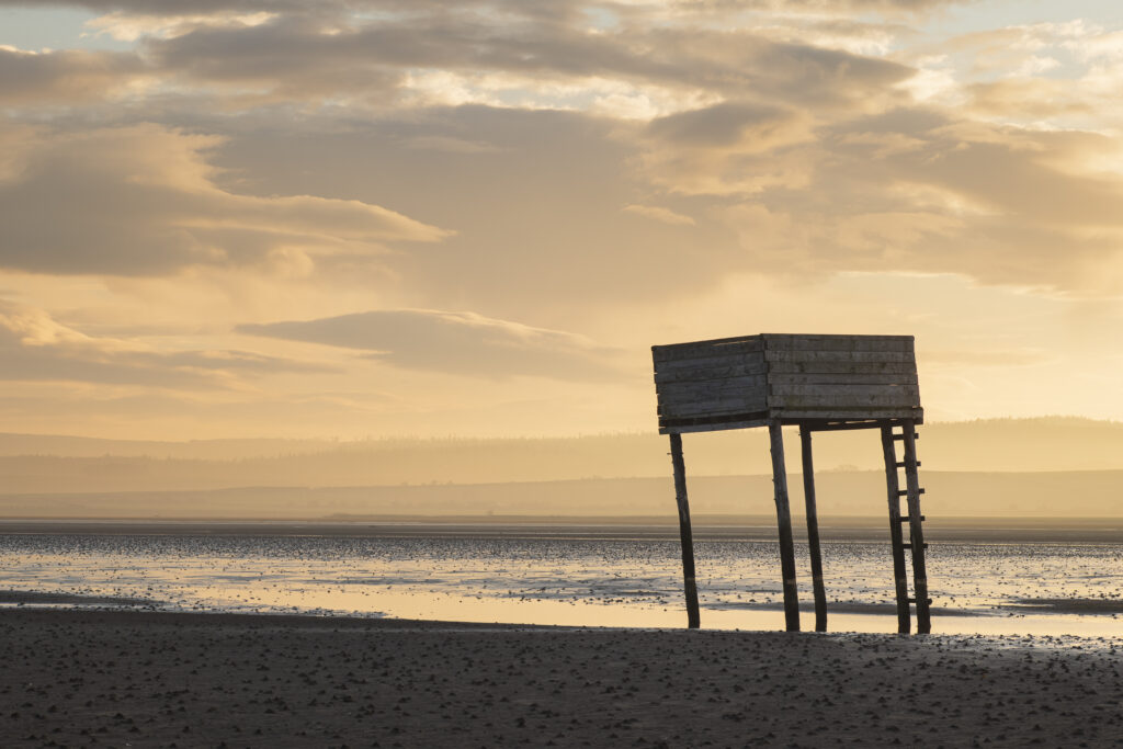 England, Northumberland, Northumberland Heritage Coast. Emergency shelter on the Pilgrim's Causeway linking the Holy Island of Lindisfarne off the Northumberland Coast with the mainland.