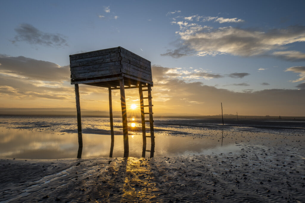 England, Northumberland, Northumberland Heritage Coast. Emergency shelter on the Pilgrim's Causeway linking the Holy Island of Lindisfarne off the Northumberland Coast with the mainland.