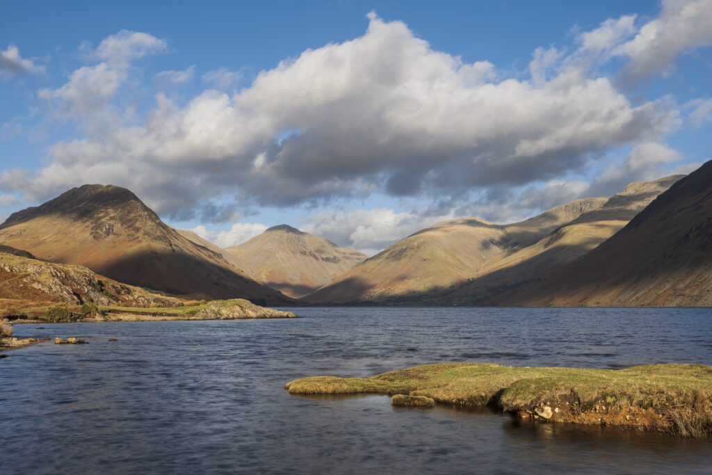 England, Cumbria, Lake District National Park. After light illuminates Great Gable and the other mountains surrouding Wasdale, viewed from Wastwater - The deepest lake in England.