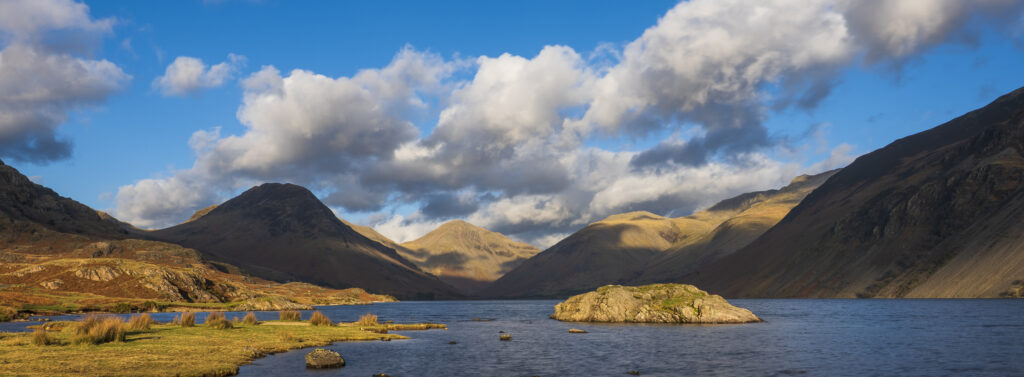 England, Cumbria, Lake District National Park. After light illuminates Great Gable and the other mountains surrouding Wasdale, viewed from Wastwater - The deepest lake in England.