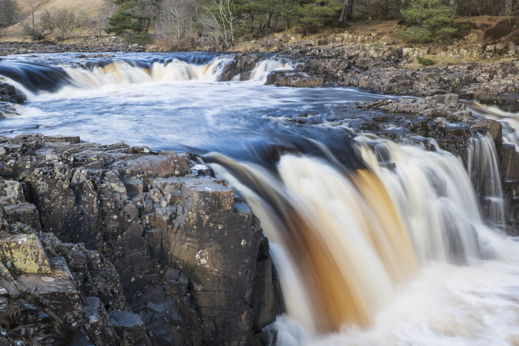 England, County Durham, Low Force. The River Tees cascades down the Low Force waterfall in County Durham.