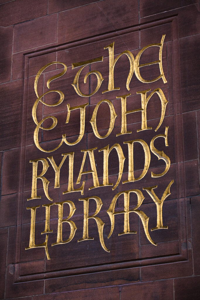 England, Greater Manchester, Manchester. Detail shot of sign on the The John Rylands Library building in the Springfields Area.