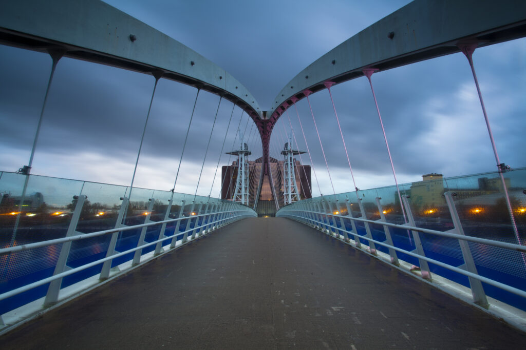England, Greater Manchester, Salford Quays. The Lowry Bridge at dusk, located on the Salford Quays in the city of Salford near Manchester Old Trafford.