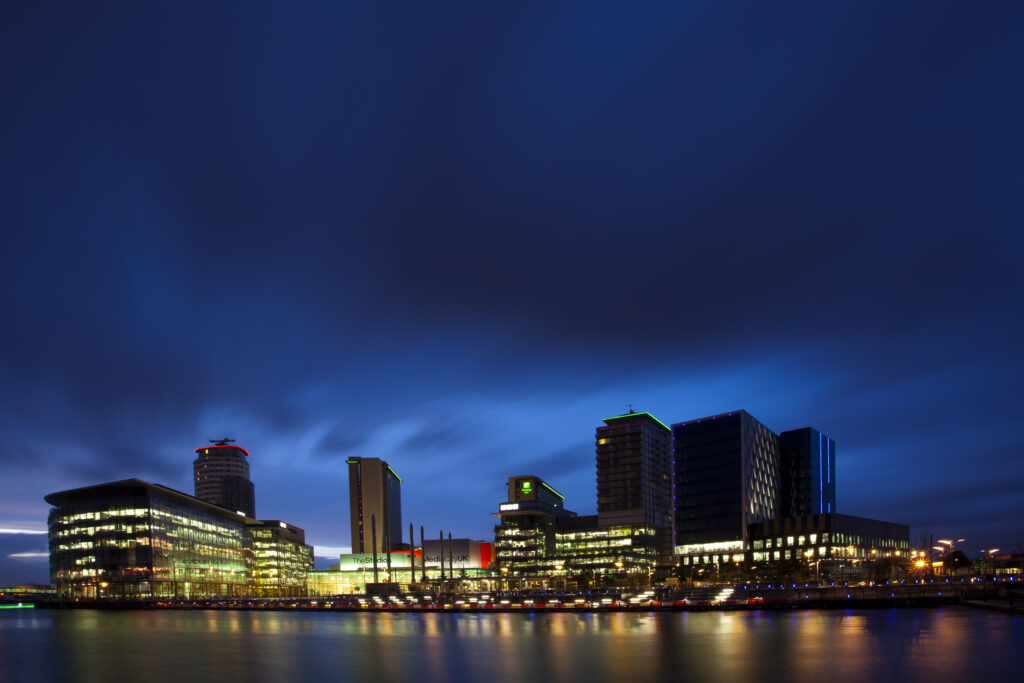 England, Greater Manchester, Salford Quays. Media City UK complex at dusk, located on the Salford Quays in the city of Salford near Manchester Old Trafford.