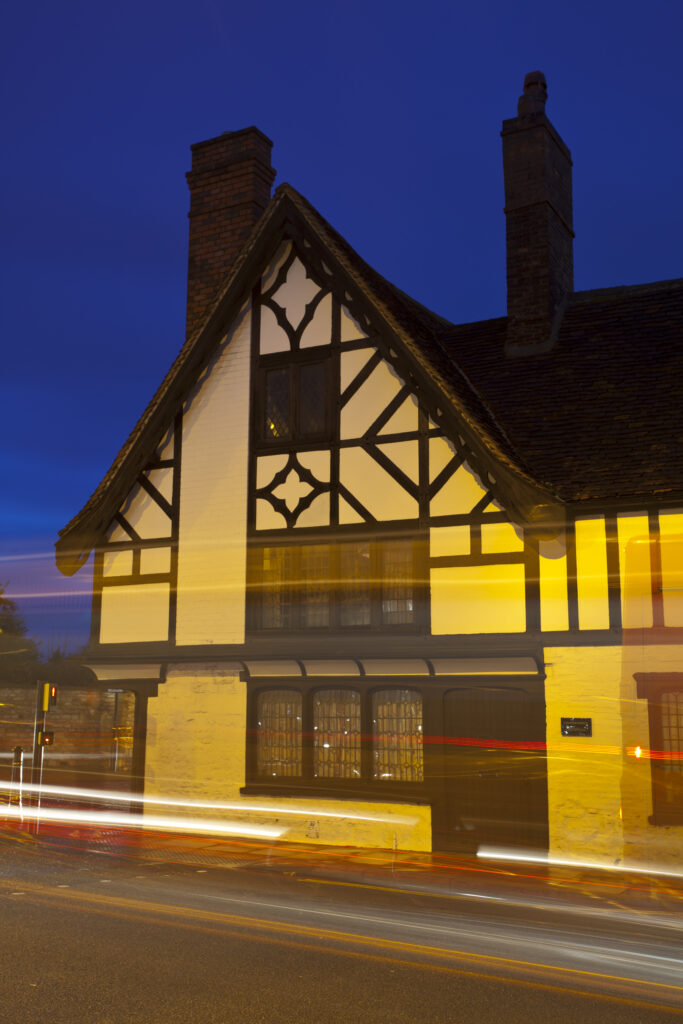 England, Lincolnshire, Lincoln. Traffic at dusk at the Priorygate near Lincoln Cathedral in the city of Lincoln.