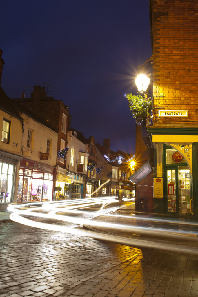 England, Lincolnshire, Lincoln. Traffic at dusk along Eastgate in the historic UK city of Lincoln.