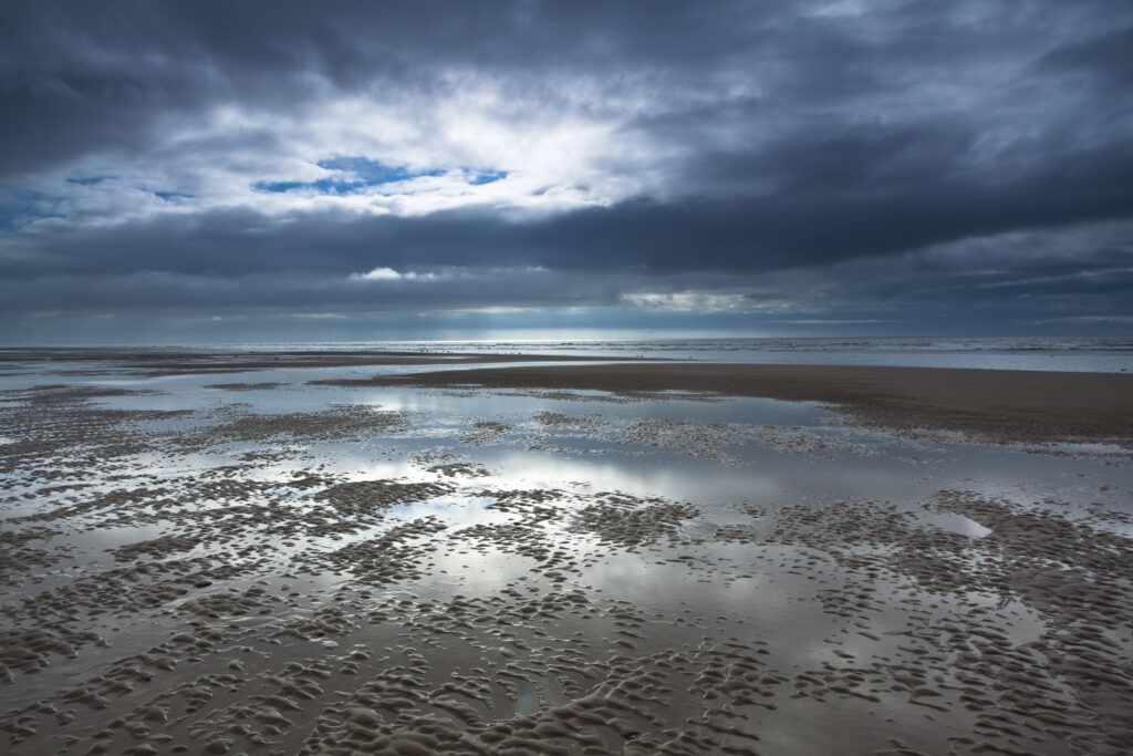 England, Lancashire, Blackpool. Dramaic light above the Irish Sea along the South Shore at Blackpool.