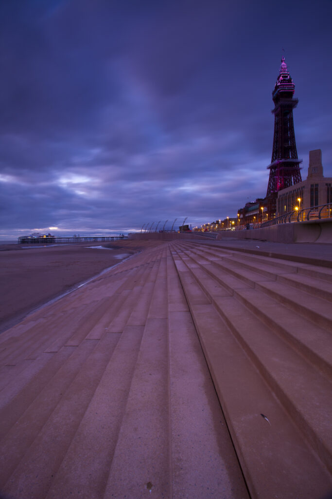 England, Lancashire, Blackpool. Looking towards the North Pier and Blackpool Tower, a famous landmark of the popular seaside resort.