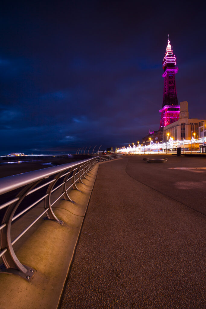 England, Lancashire, Blackpool. Looking towards the North Pier and Blackpool Tower, a famous landmark of the popular seaside resort.