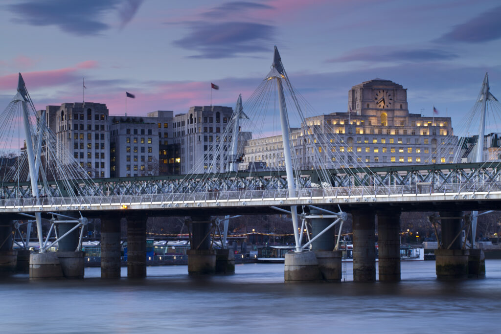 England, Greater London, London South Bank / River Thames. Looking across the River Thames from the South Bank to the Golden Jubilee Bridge