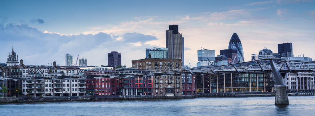 England, Greater London, London City. London City Financial District (including the Gherkin) and the London Millennium Footbridge crossing the River Thames.