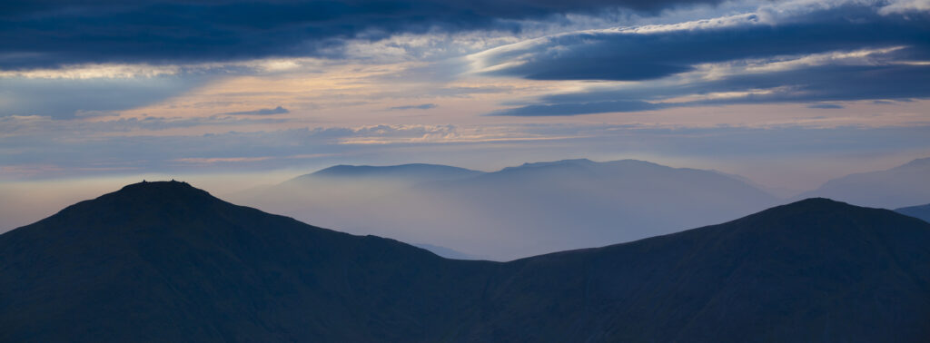 Mountain fog in the valleys of the Lake District National Park.