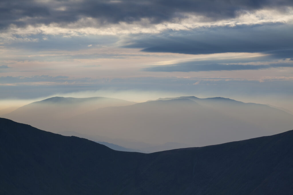 Mountain fog in the valleys of the Lake District National Park.