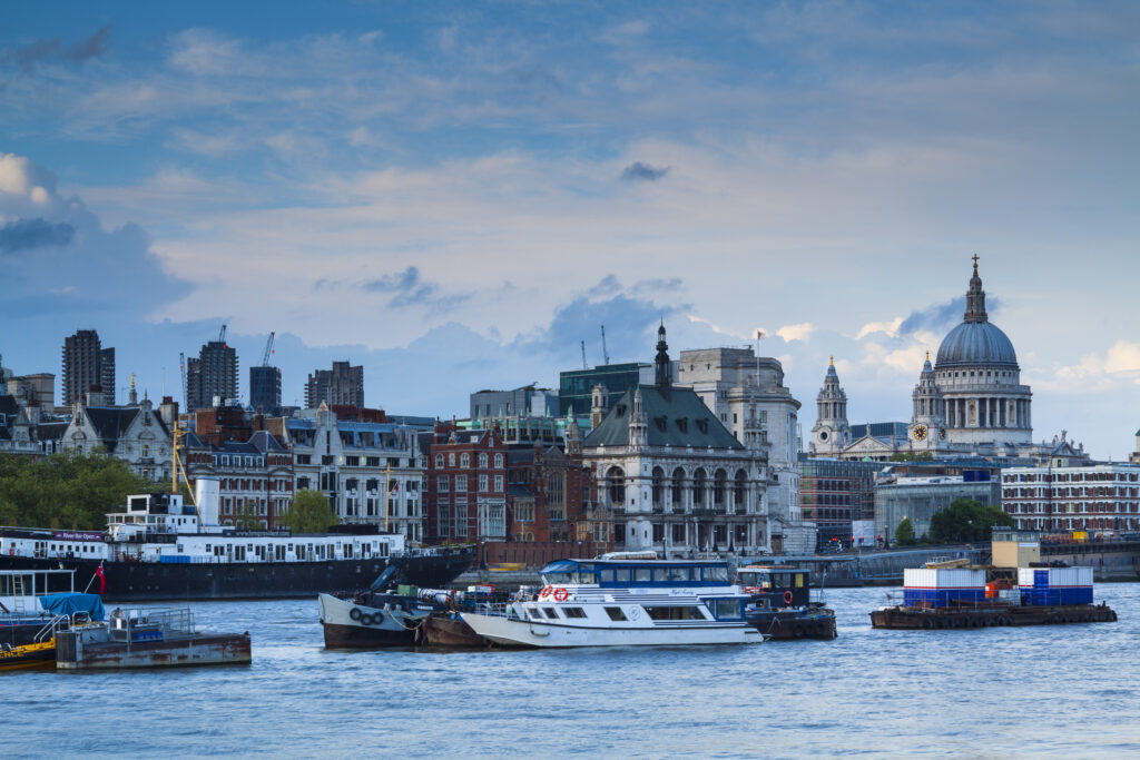 England, Greater London, London City. St Pauls Cathedral and the River Thames at Dusk.