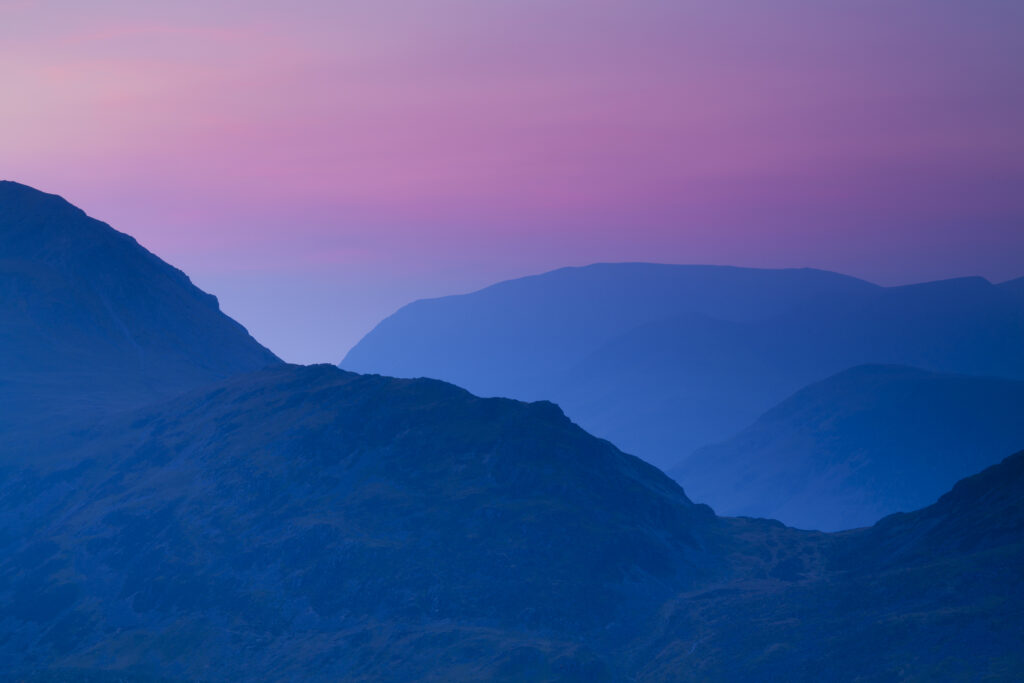 England, Cumbria, Lake District National Park. Dusk over the mountains of the remote North-Western Lake Distrcit National Park.