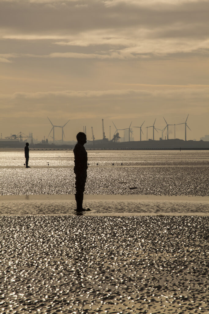 England, Merseyside, Antony Gormley Another Place. Antony Gormley sculptures at Crosby Beach near Liverpool in England.