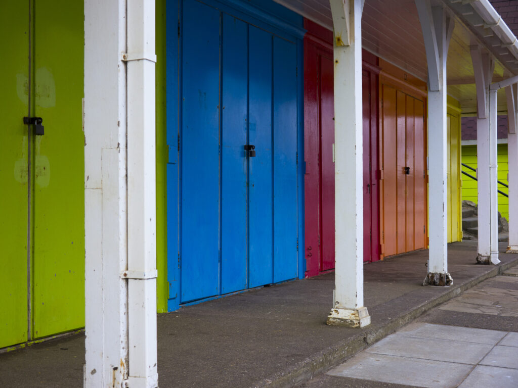 England, North Yorkshire, Scarborough. Colourful beach huts located on Scarborough South Bay.