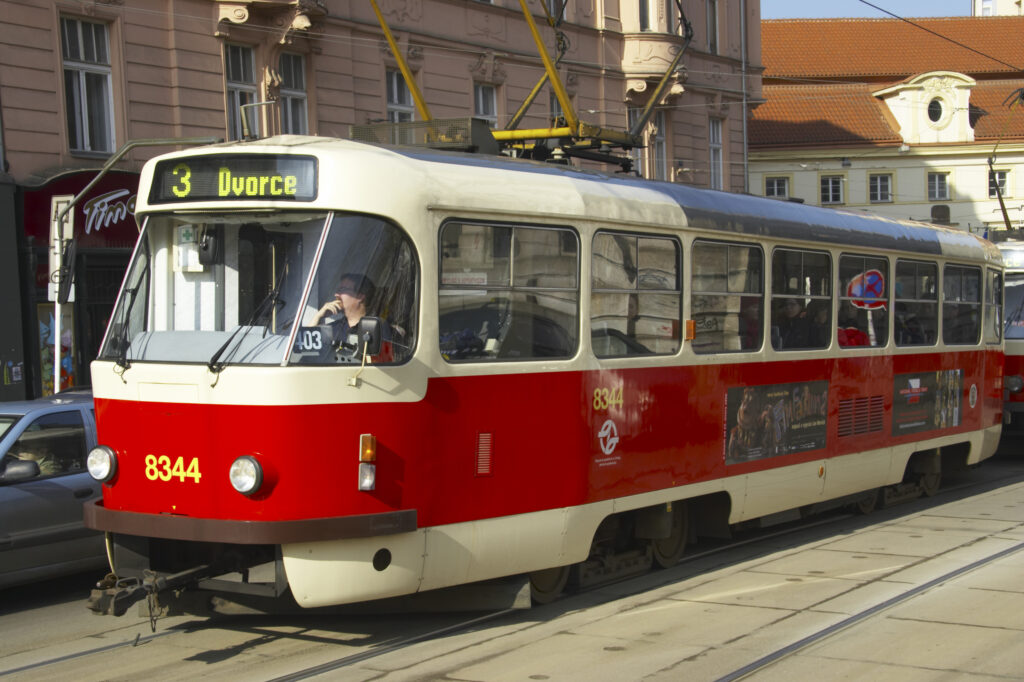 Czech Republic, Prague, Prague City. A red tram provides public transport in the city of Prague.