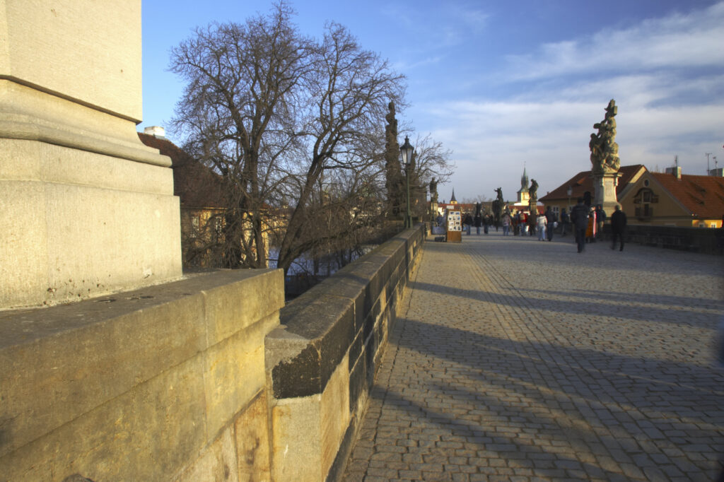 Czech Republic, Prague, Charles Bridge. Afternoon light illuminates the gothic features of Charles Bridge in the city of Prague