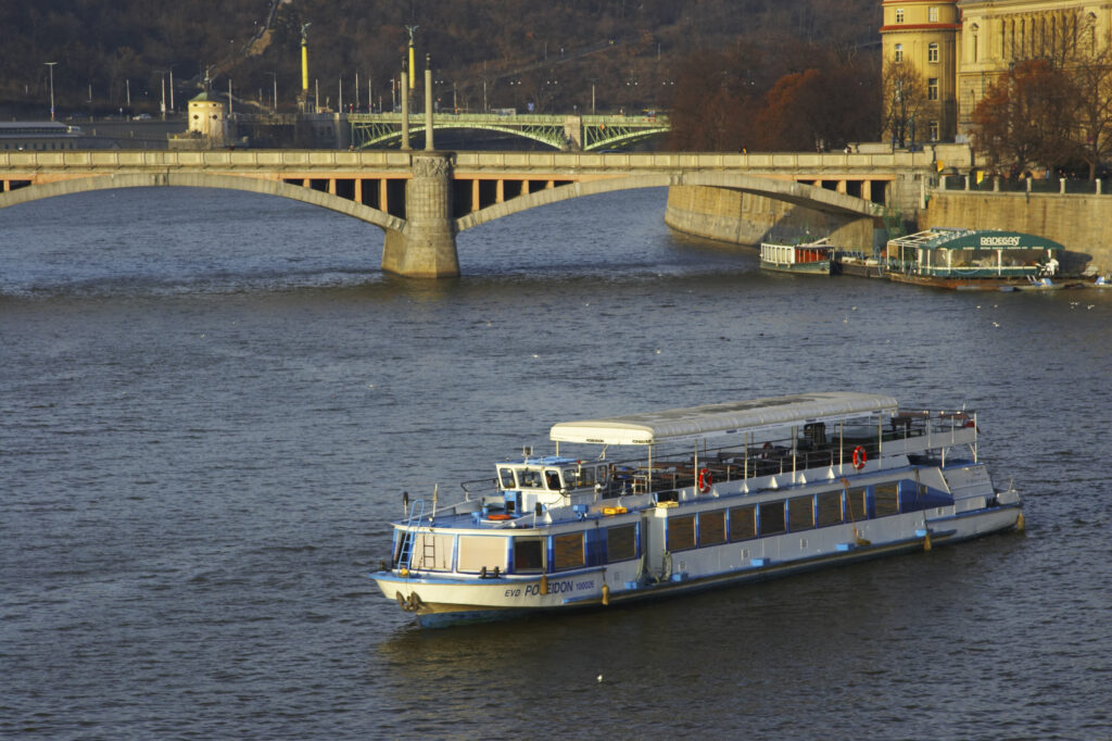 Czech Republic, Prague, Vltava river. Sight seeing cruise on the Vltave River in the city of Prague, viewed from Charles Bridge.