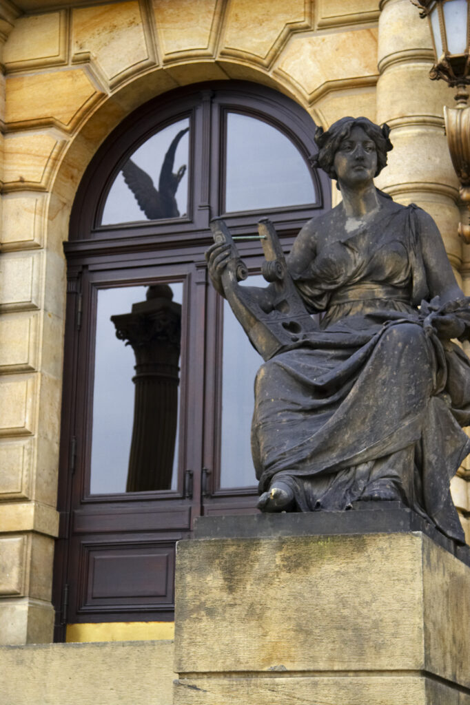 Czech Republic, Prague, Rudolfinum Concert Hall and Gallery. Statue and typical Prague architecture outside the Rudolfinum Concert Hall