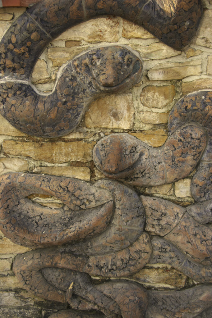 Czech Republic, Prague, Prague City. Snake / serpent design on a wall near to the Communism memorial in Prague
