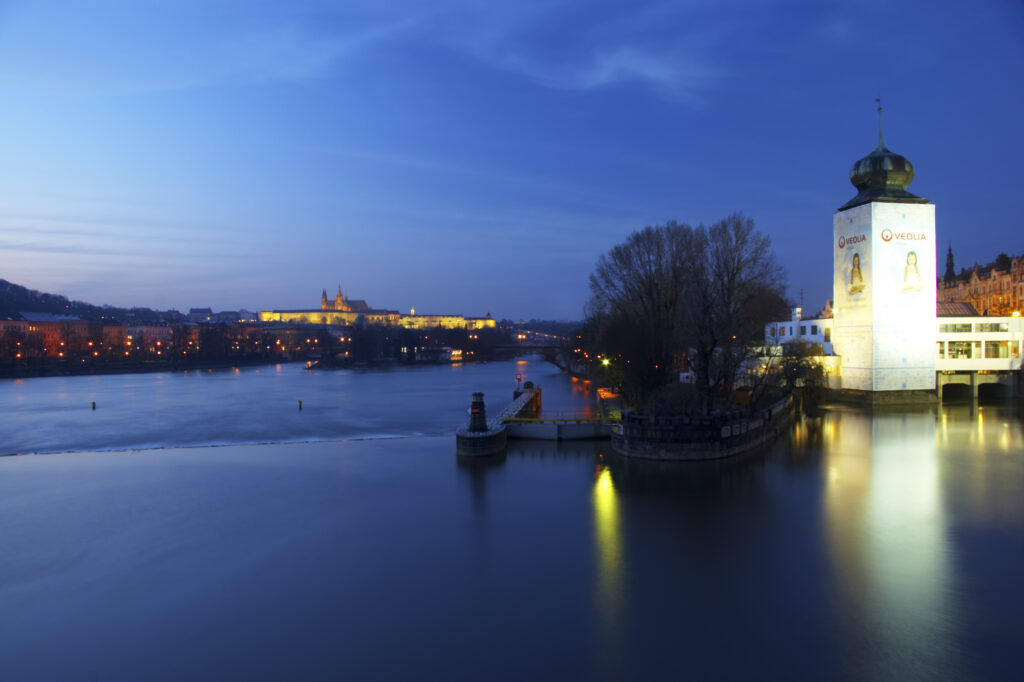 Czech Republic, Prague, Prague City. Prague city at dusk with Prague Castle reflected in the still waters of the Vltave River.