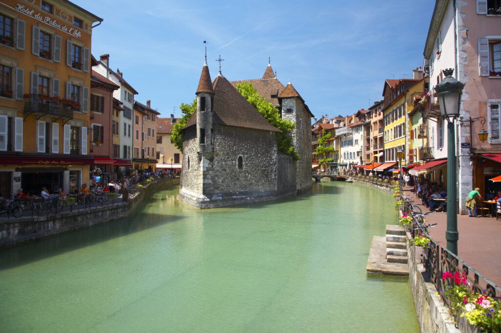 France, Rhône-Alpes, Annecy. The Palais de L'Isle, a former prison now converted to a museum, situated on the Thiou Canal, the main canal running through the heart of the town of Annecy.