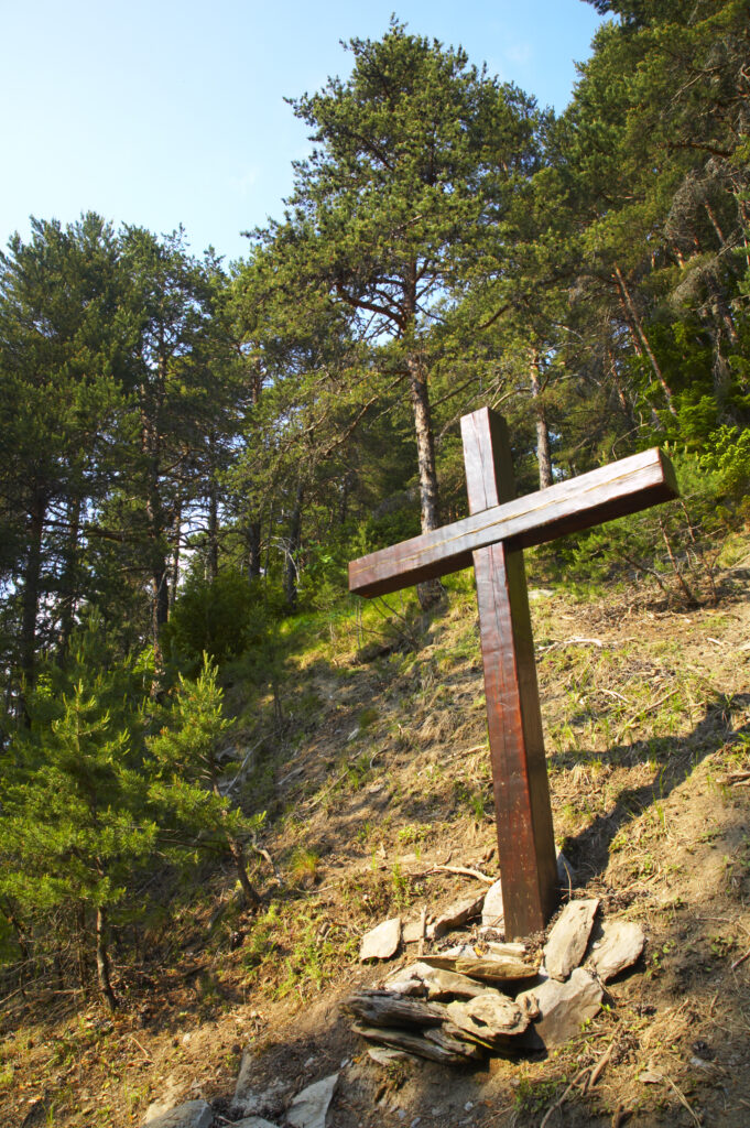 France, Rhône-Alpes, Le Bourg d Oisans. A wooden cross located in a forest (Foret de Marronne) near Le Bourg d Oisans.
