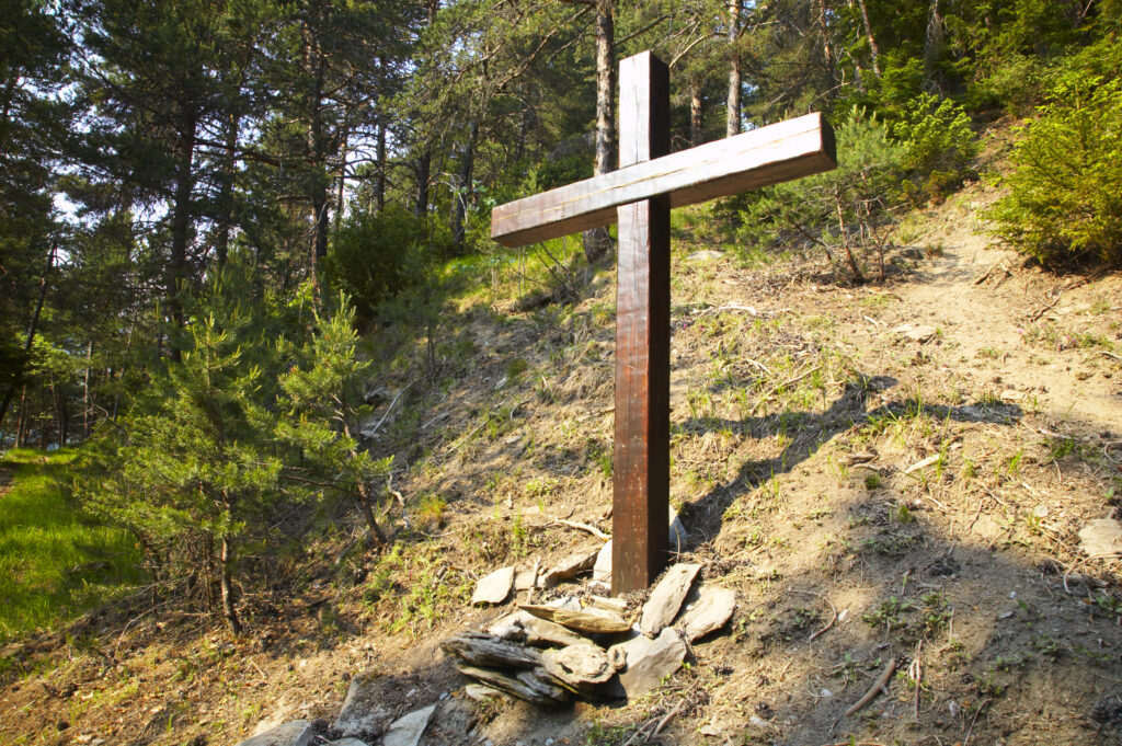 France, Rhône-Alpes, Le Bourg d Oisans. A wooden cross located in a forest (Foret de Marronne) near Le Bourg d Oisans.