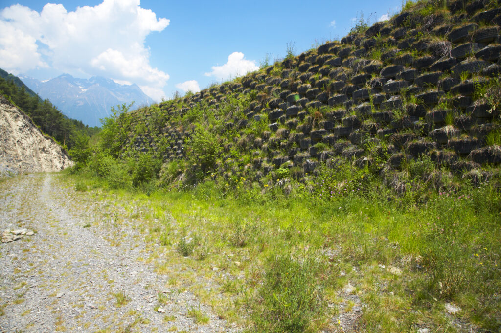 France, Rhône-Alpes, Le Bourg d Oisans. Worn car, lorry and tractor tyres are recycled to provide flood protection on the river bed near the Bourg d Oisans