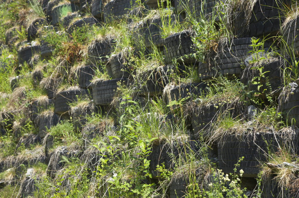 France, Rhône-Alpes, Le Bourg d Oisans. Worn car, lorry and tractor tyres are recycled to provide flood protection on the river bed near the Bourg d Oisans