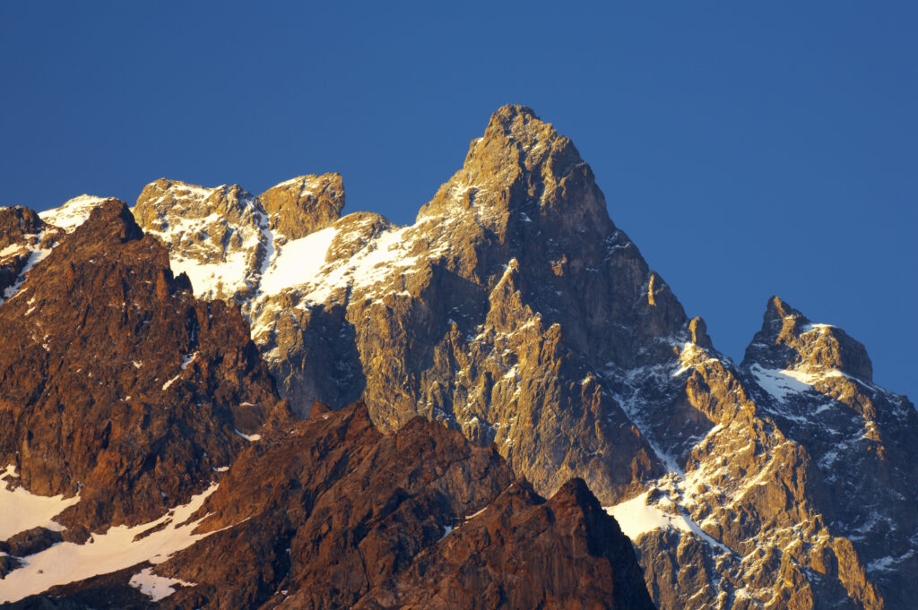 France, Rhône-Alpes, The Ecrins National Park. Morning light illuminates the peak of La Meije, within the Ecrins National Park near the village of La Grave.