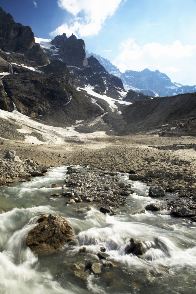 France, Rhône-Alpes, The Ecrins National Park. Mountain stream (Torrent de l'Abergue) running through a wild mountain landscape located near the village of La Grave and the Chal Vachere