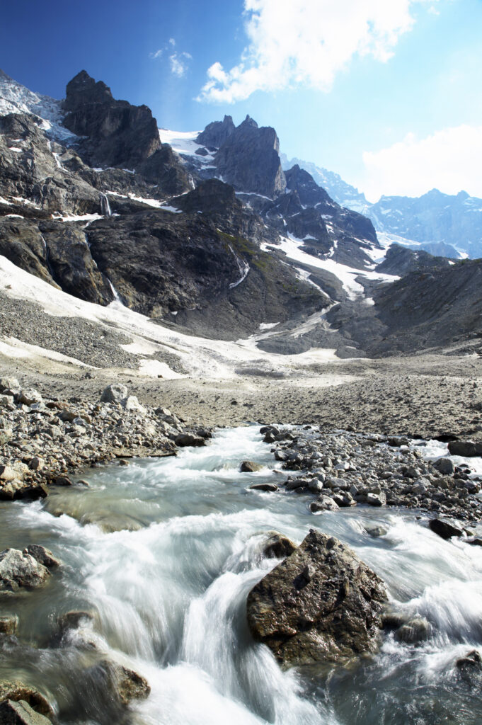 France, Rhône-Alpes, The Ecrins National Park. Mountain stream (Torrent de l'Abergue) running through a wild mountain landscape located near the village of La Grave and the Chal Vachere
