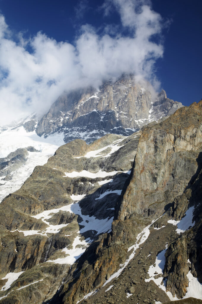 France, Rhône-Alpes, The Ecrins National Park. Evening light bathes the majestic peak of La Meije and surrounding glaciers.